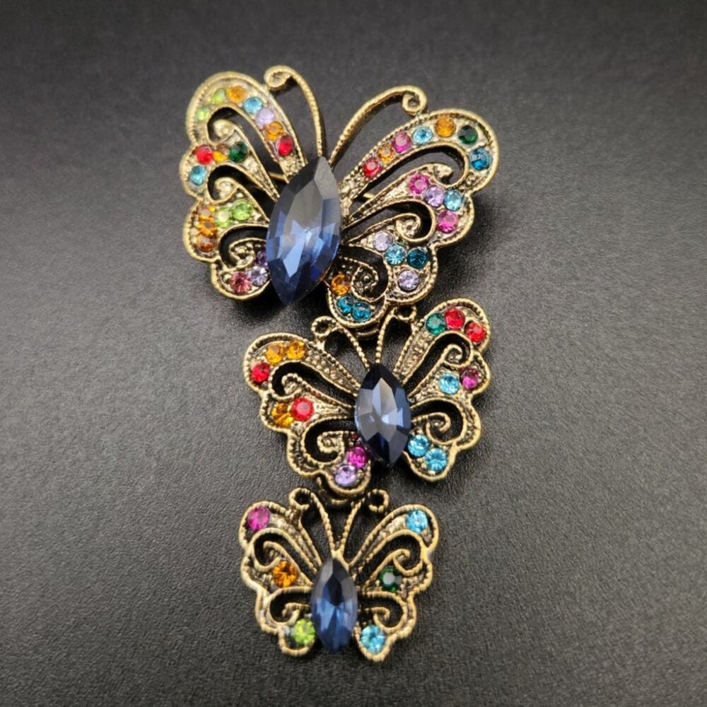 Tiered Gold Tone Butterfly Brooch Multi Color Rhinestones & Blue Center Stones
